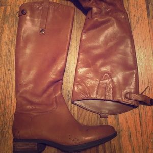 Boots, perfect for fall. Hits just below the knee.